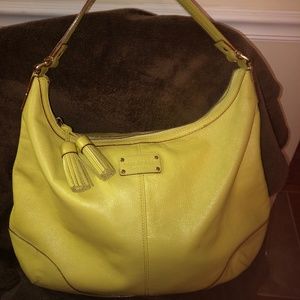 large yellow Kate Spade hobo handbag